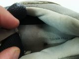a hand that is holding a piece of fabric in a bag