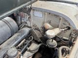 an old car engine with a lot of rust on it