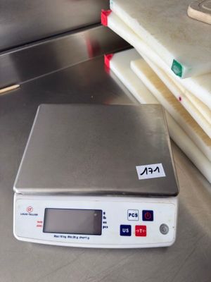 a scale that is sitting on a table in a kitchen