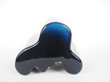 a black and blue vase sitting on a white surface