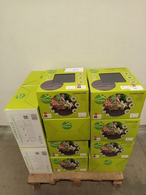 three boxes of food are stacked on a pallet in a warehouse