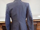 an image of a suit on a mannequin on a table