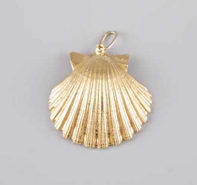 a gold plated shell pendant on a white background