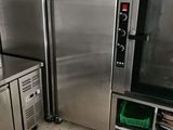a kitchen with a lot of stainless steel appliances in it