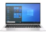un ordinateur portable ouvert posé sur une surface blanche
