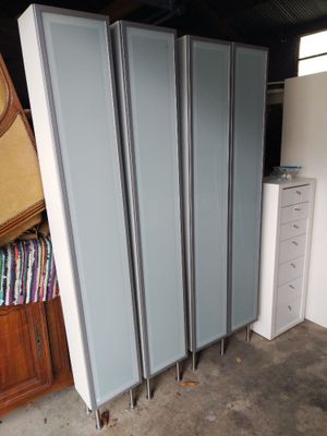 several pieces of furniture are stacked on top of each other in a garage