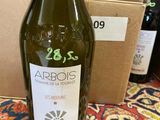 a bottle of wine sitting on a table next to a box of wine