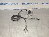 a picture of a cable connected to an electrical device on a table