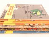 a lot of books stacked on top of each other