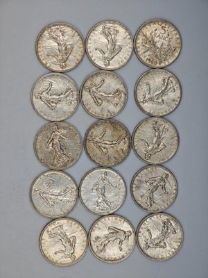 a close up of a bunch of coins sitting on top of a table