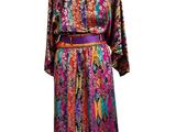 a women ' s colorful dress with a belt on a mannequin mannequin