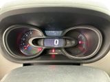 a car dashboard with a digital display and a steering wheel