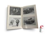 an open book with pictures of military vehicles on it
