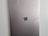 an apple macbook pro laptop sitting on top of a white wall