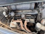 a dirty engine in the back of a car