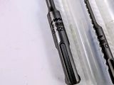 three different types of drill bits are sitting on a white surface