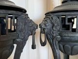 two metal objects that are sitting on a table
