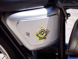 a close up of a motorcycle parked on the side of the road