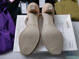 a pair of shoes sitting on top of a box