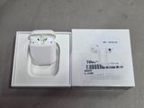 a white box with an apple airpods on top of it