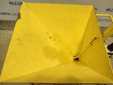 a yellow umbrella sitting on top of a metal cart