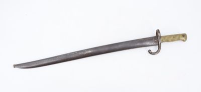 a close up of a knife on a white surface with a white background