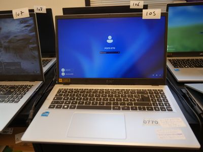 three laptops that are sitting on a table