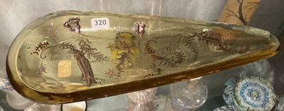 a glass boat shaped like a boat with a dragon on it