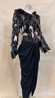 an image of a mannequin dressed in a black dress