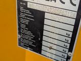 a close up of a sign on a yellow machine
