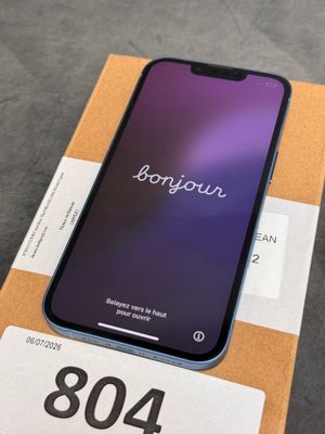 an iphone x is sitting on top of a box on a table