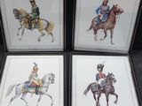 three framed pictures of soldiers riding horses and a soldier on a horse