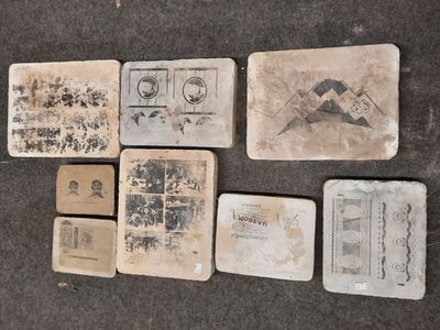 several pieces of old paper with stamps on them on a table