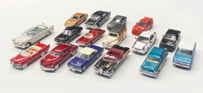 a lot of toy cars that are lined up together