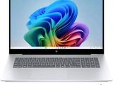 a white laptop with a colorful design on the screen