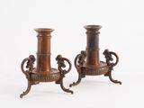 two brown vases sitting on top of each other on a white surface