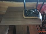 a small table with a broom on top of it