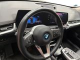 the interior of a car with a steering wheel and dashboard controls