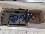 a box full of blue batteries sitting on a table