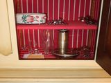a small cabinet with a lot of items inside of it