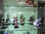 many figurines on display in a glass case