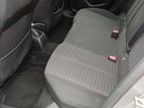 a seat in the back of a car with a red button on it