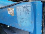 a close up of a tire on a blue vehicle