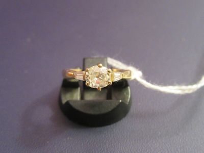 an image of a diamond ring on a black stand