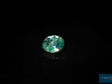 a green tourmaline gems on a black background