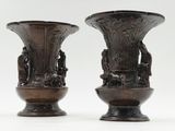 two vases that are sitting next to each other on a table