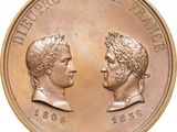 the two men are facing each other on a coin