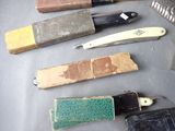 many different types of knives on a table