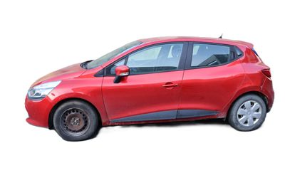 a red car that is parked on the side of the road