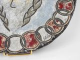 a decorative plate with a picture of a woman on it